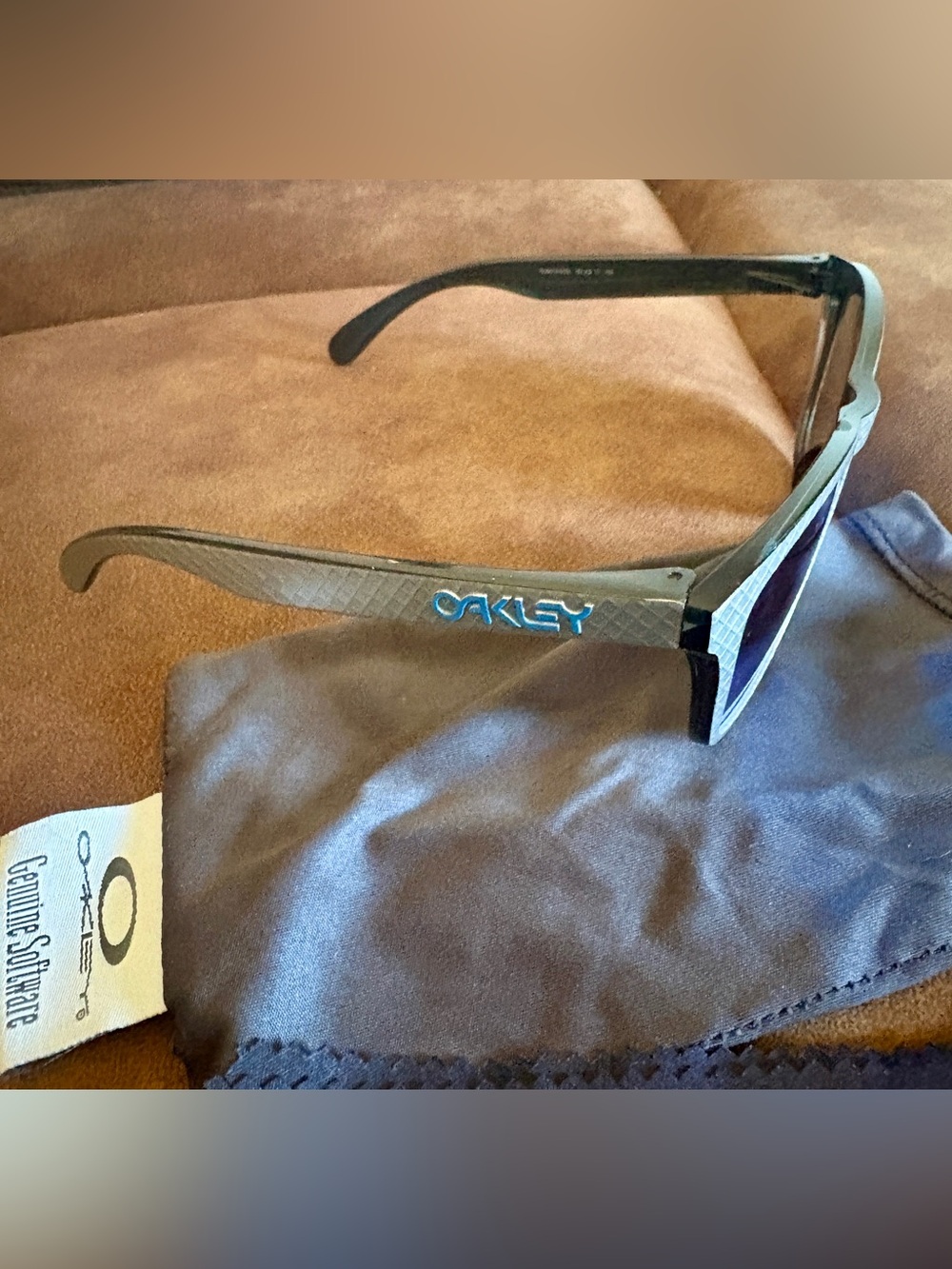 Oakley Men’s Black Sunglasses with Blue Logo Accent